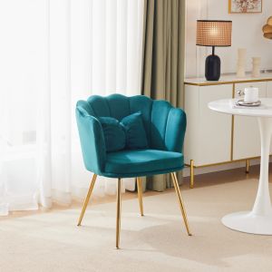 Sillón de terciopelo verde con respaldo en forma de flor y patas doradas