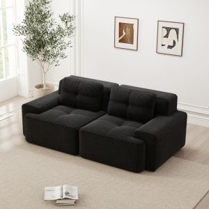 Sofá modular de pana negro con asiento profundo y diseño bajo sin montaje