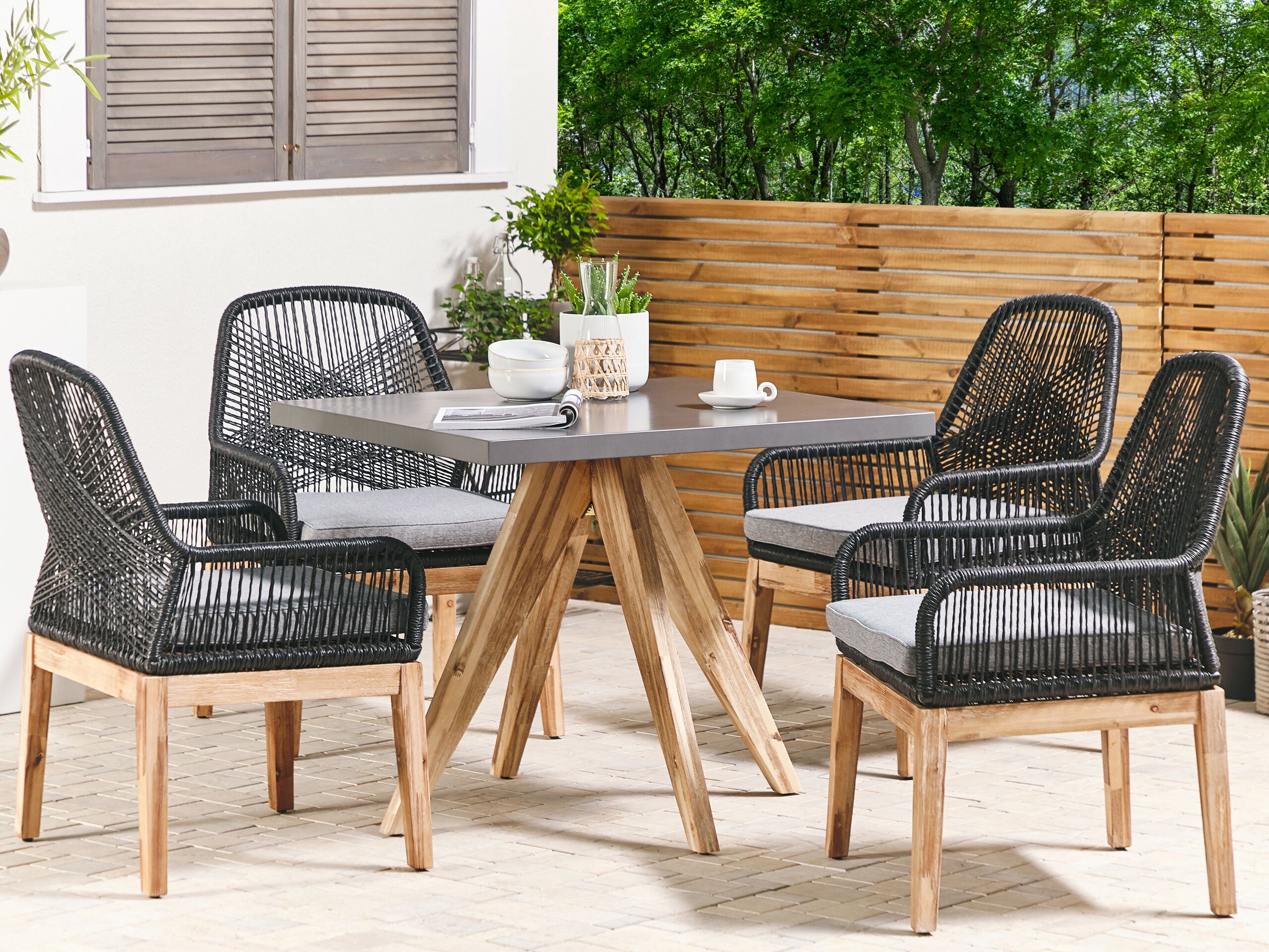 Conjunto de comedor exterior 4 plazas olbia con cojines cemento negro